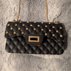 Elegant Black Quilted Handbag with Gold Accents